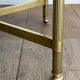 Brass coffee table with a vintage mirror top from the Baguès house.
