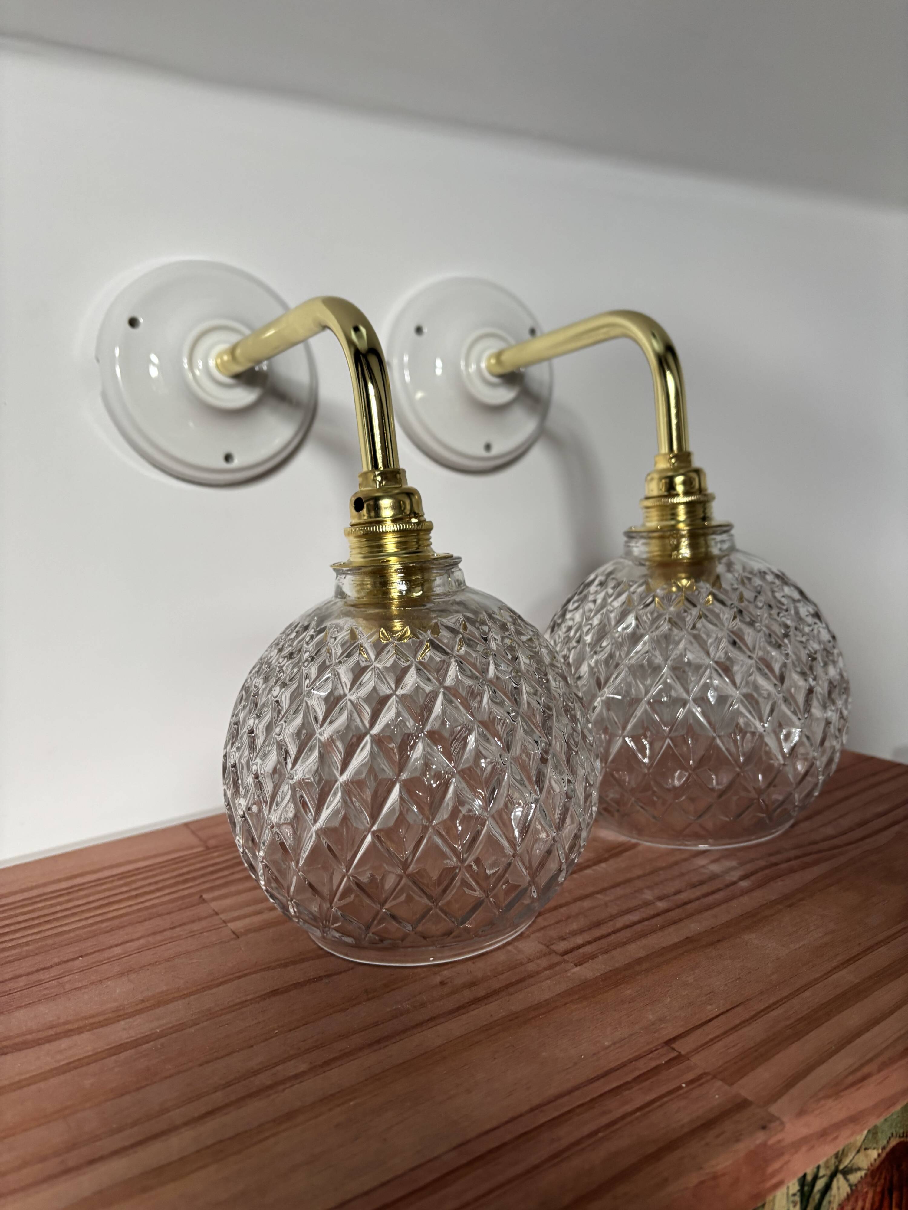Pair of chiseled glass globe wall sconces