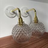 Pair of chiseled glass globe wall sconces