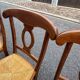 4 straw-seated chairs