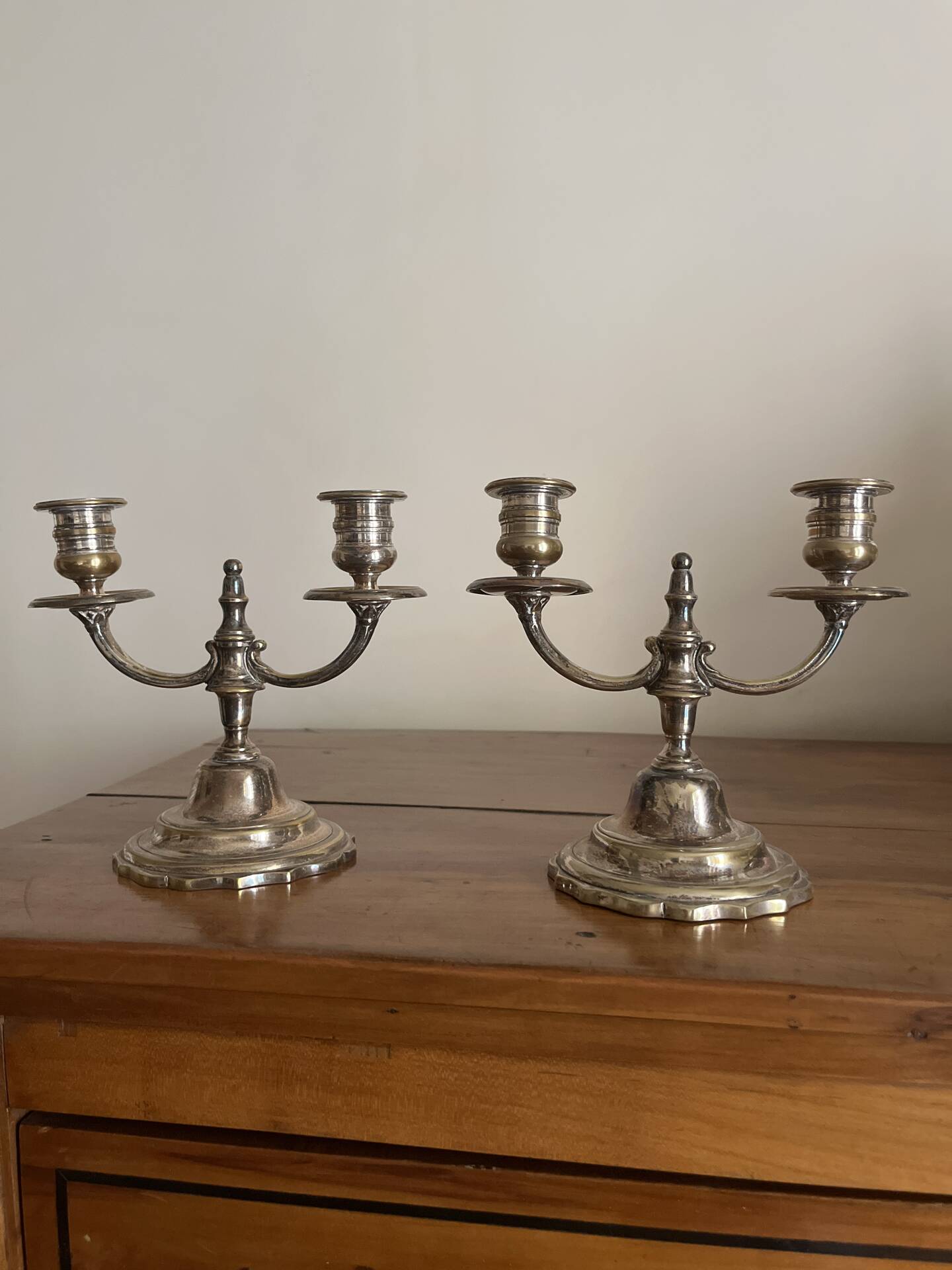 Pair of two-armed candelabra in silver-plated metal