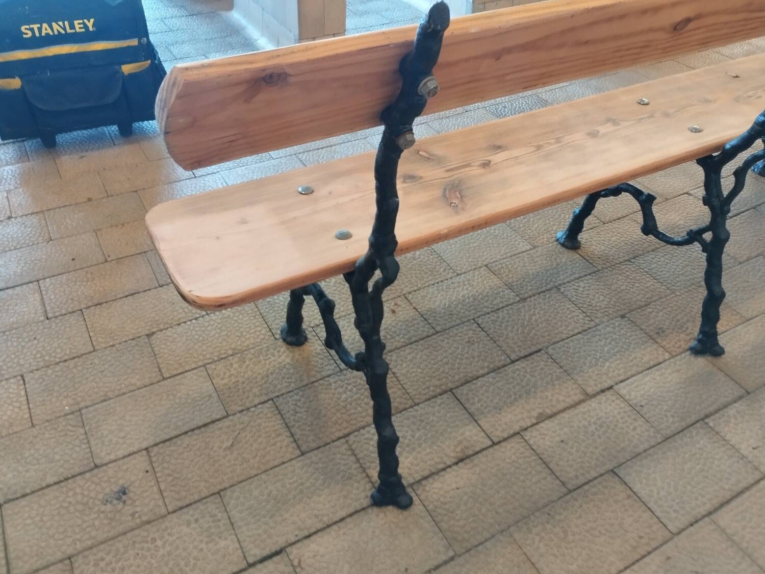 Antique garden bench with cast iron legs