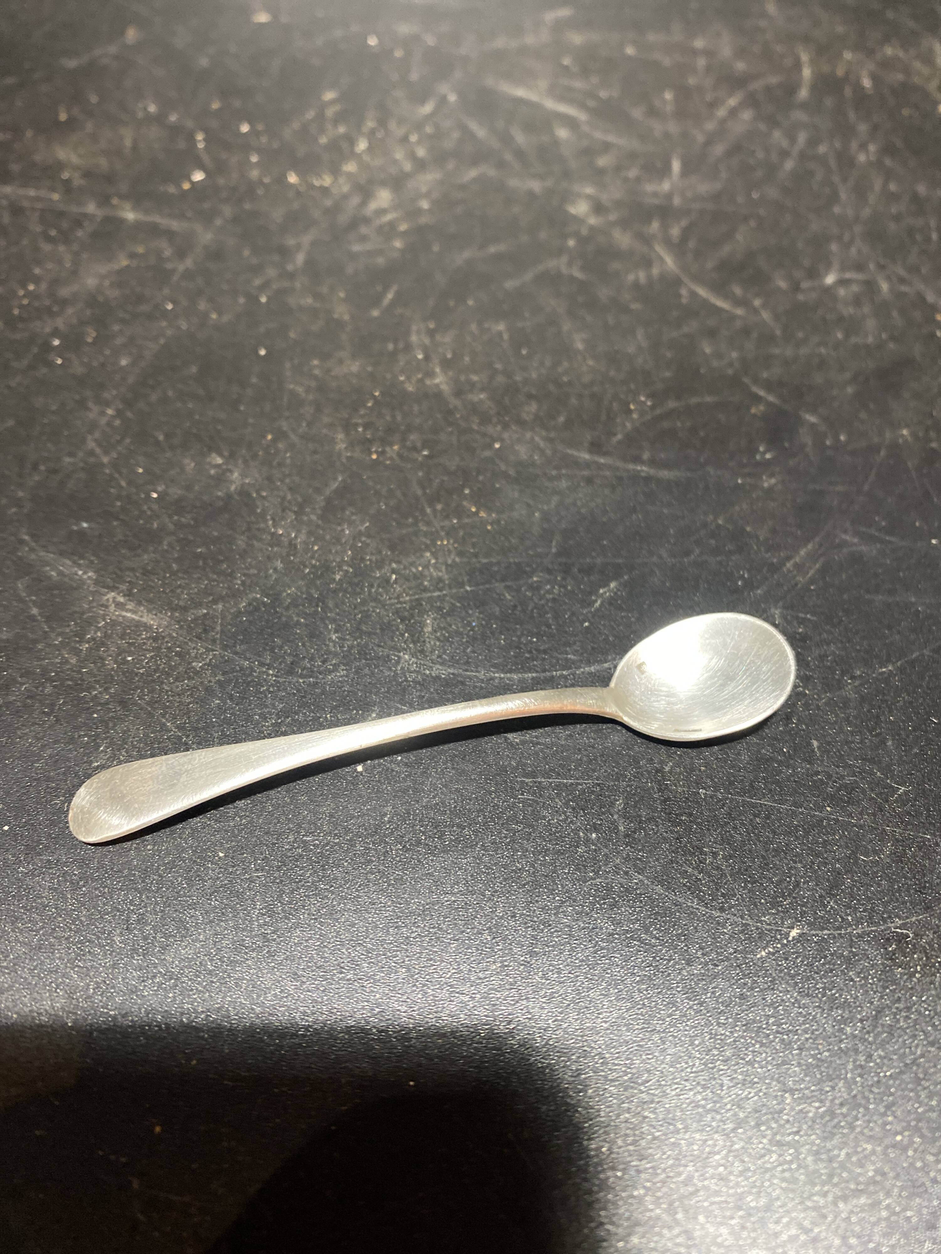 Spice centerpiece and serving spoon topped with a brass cherub