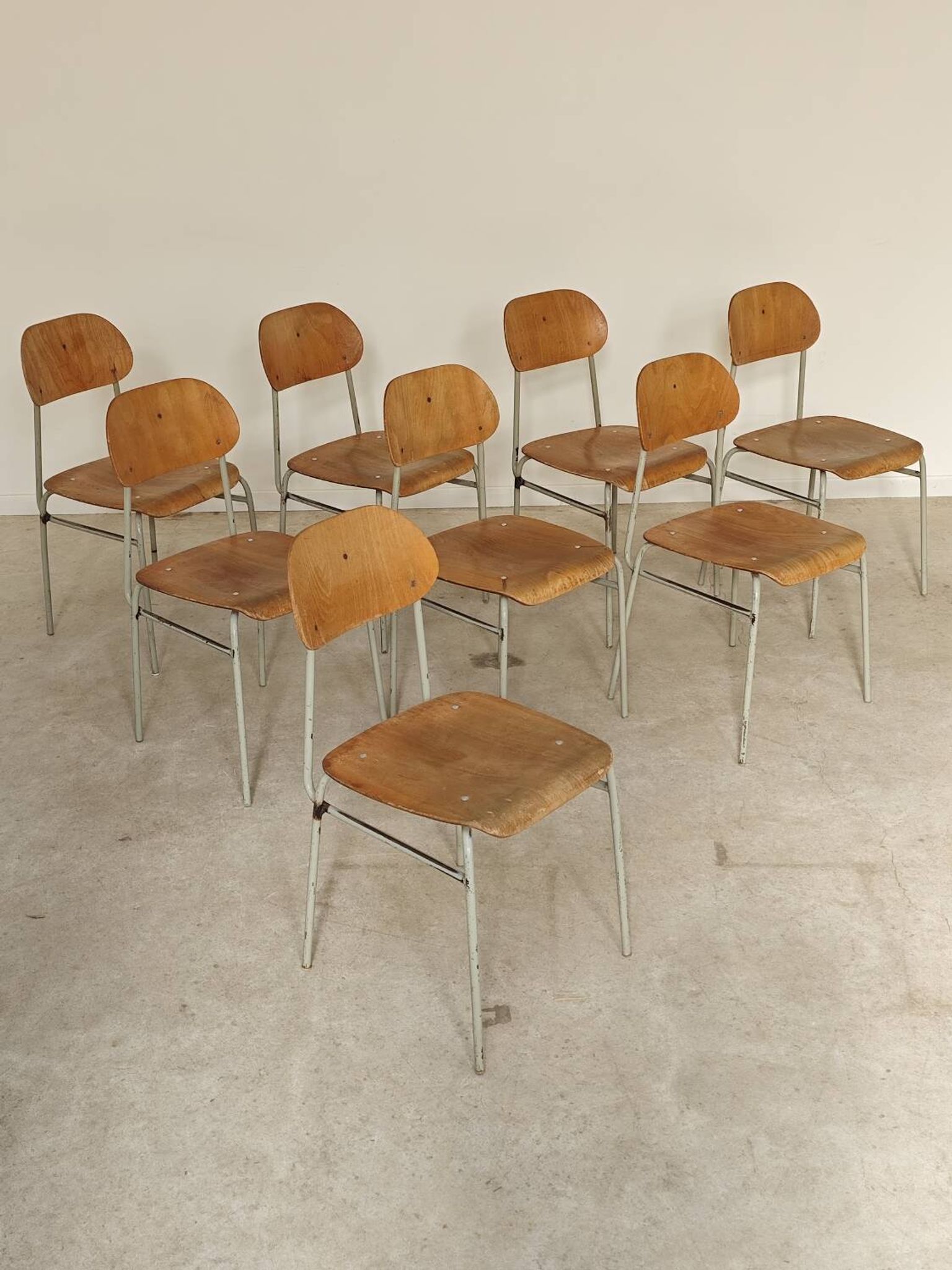 Set of 8 metal and wood school chairs  
Ex Czechoslovakia 1960