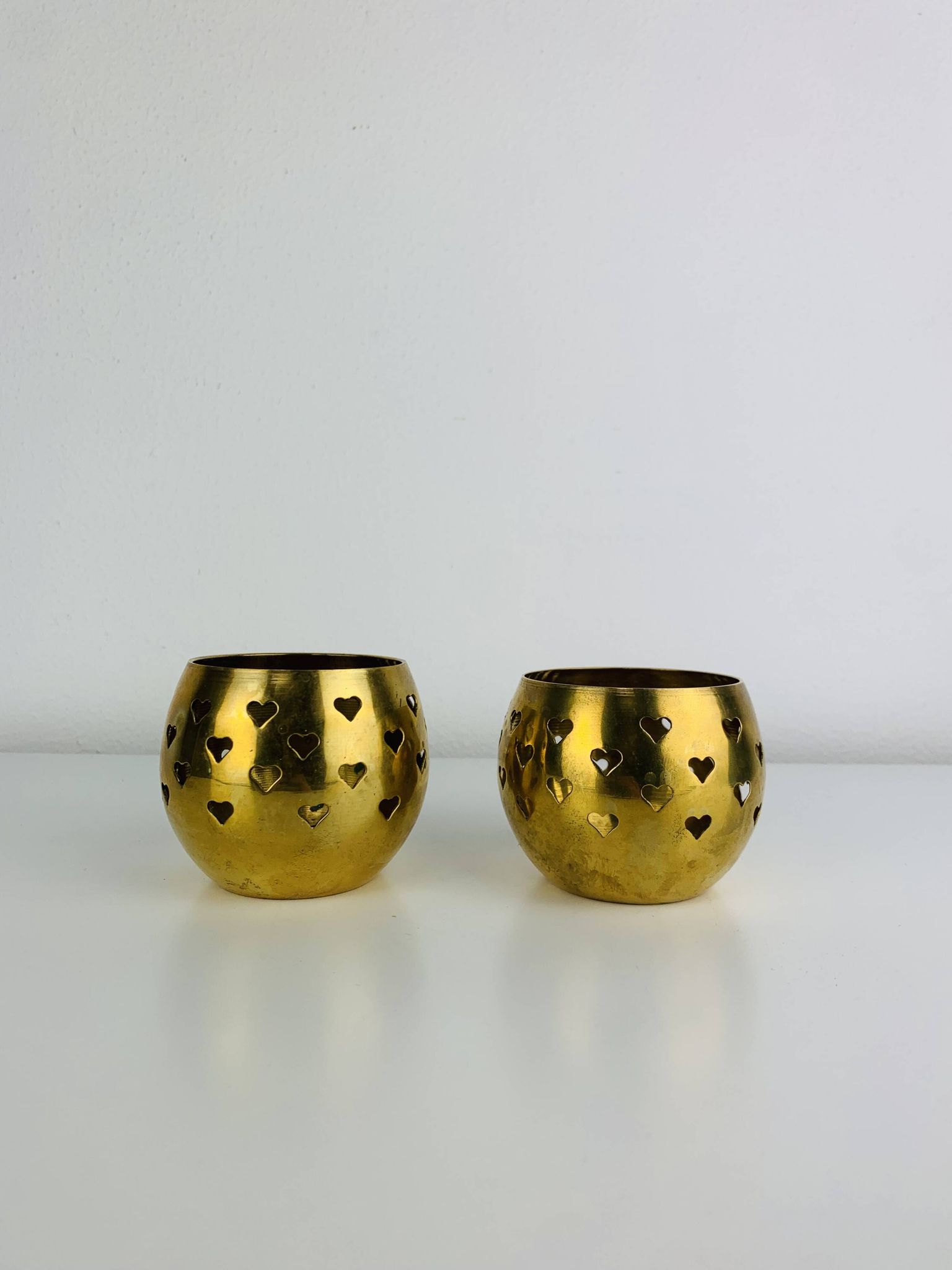 Pair of vintage openwork brass candle holders/votive candlesticks, gilded