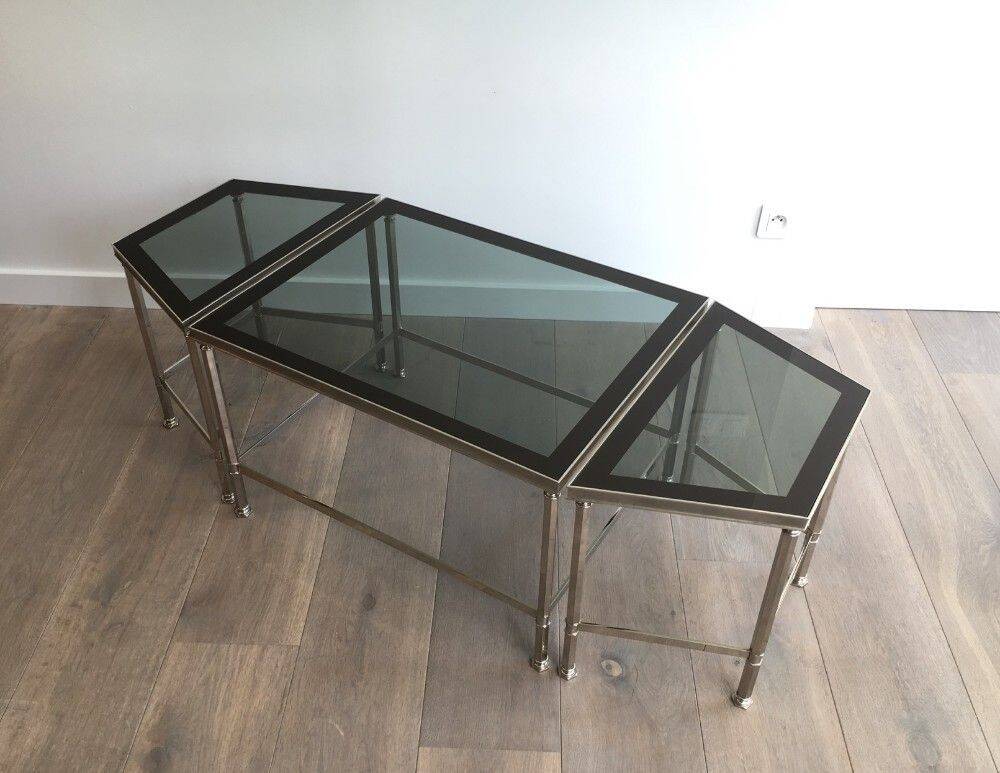Rare three-part nickel coffee table with lacquered glass tops around the perimeter