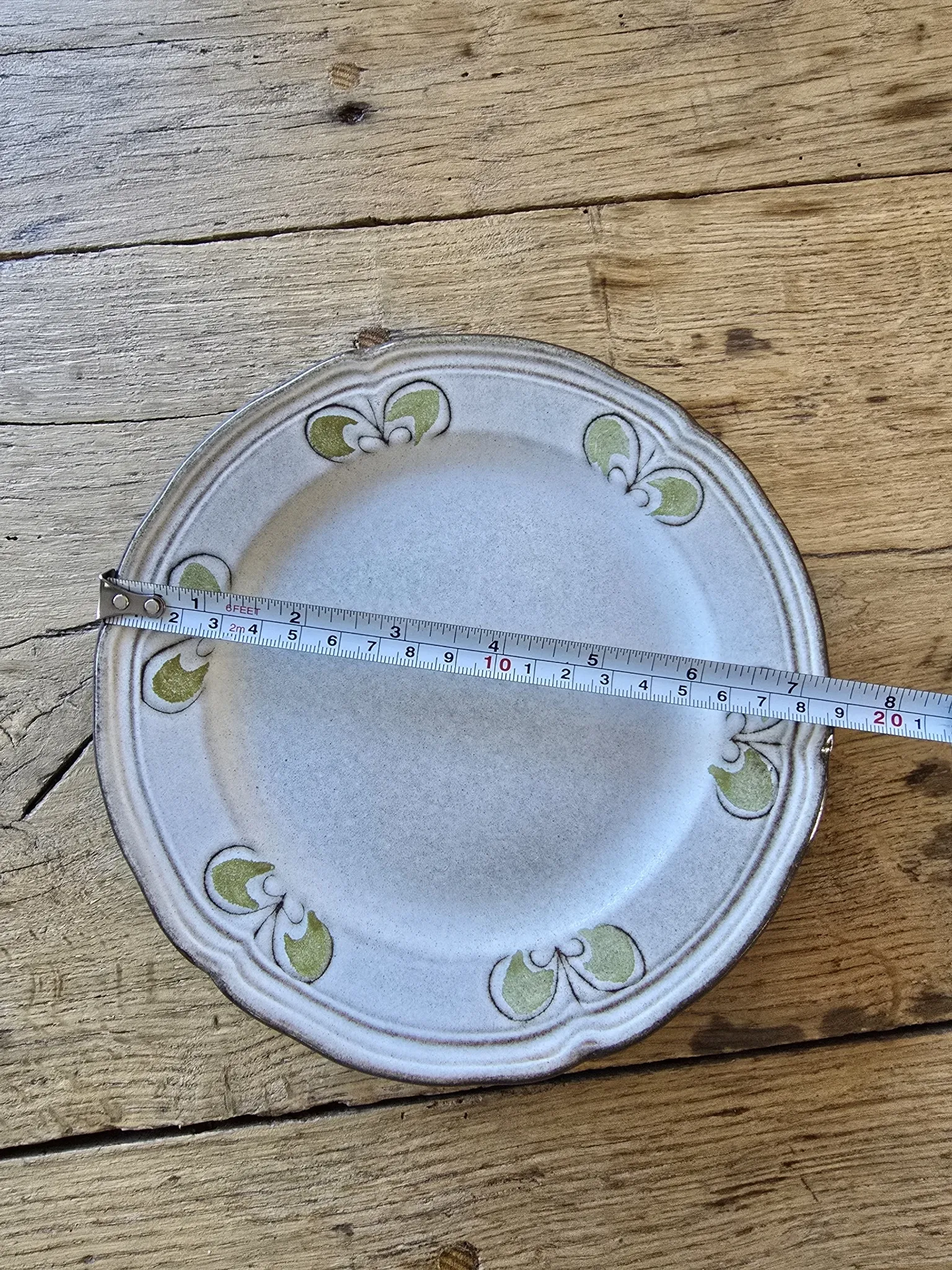 Set of 7 vintage Niderviller "Lys" painted stoneware dessert plates.