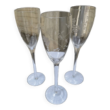 Set of 3 engraved champagne flutes.