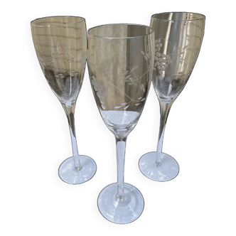 Set of 3 engraved champagne flutes.