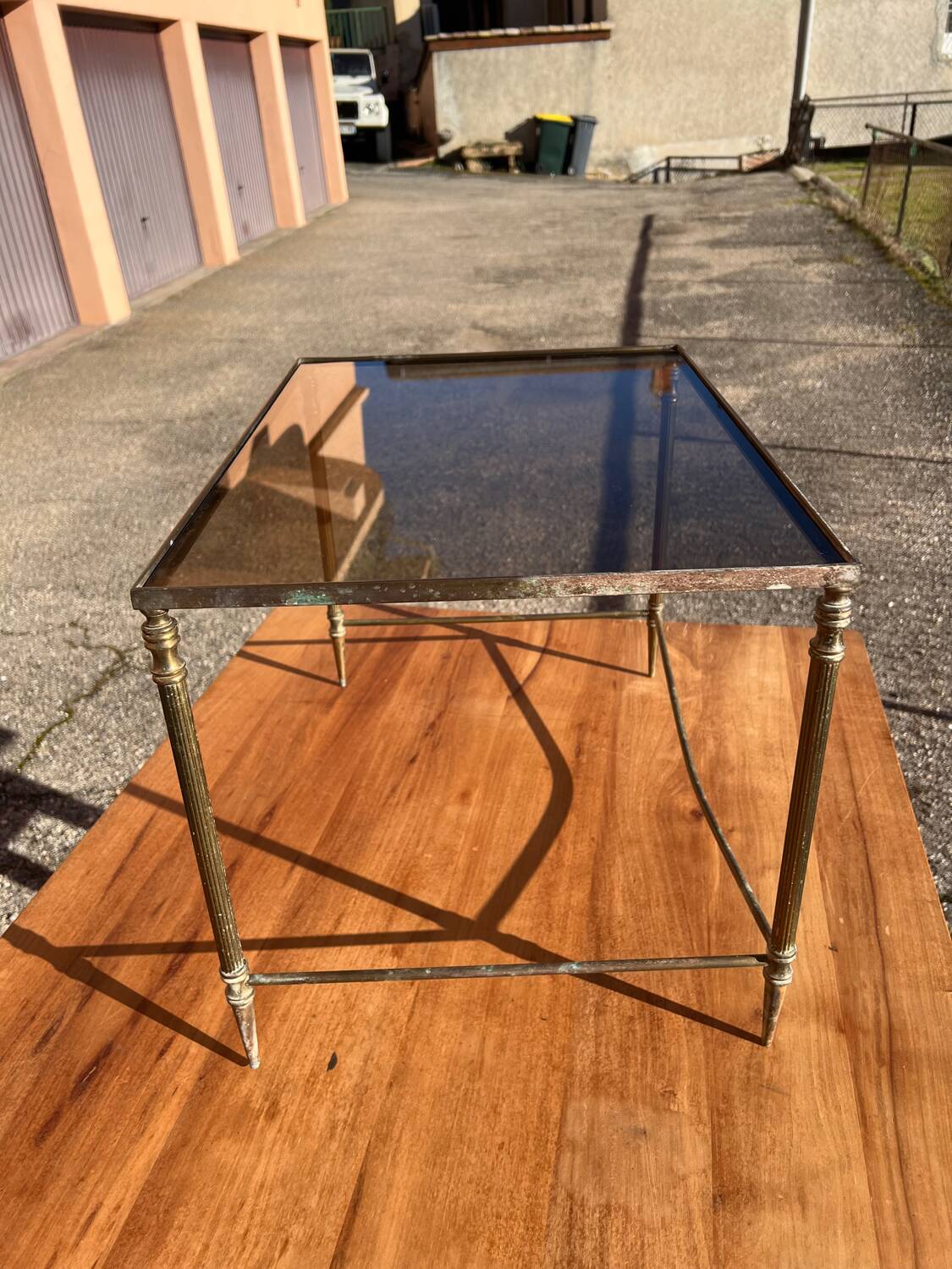 Brass side table with smoked glass.