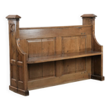 Antique oak church bench in Gothic style with beautiful wood carving