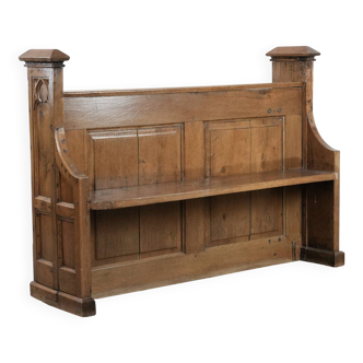 Antique oak church bench in Gothic style with beautiful wood carving