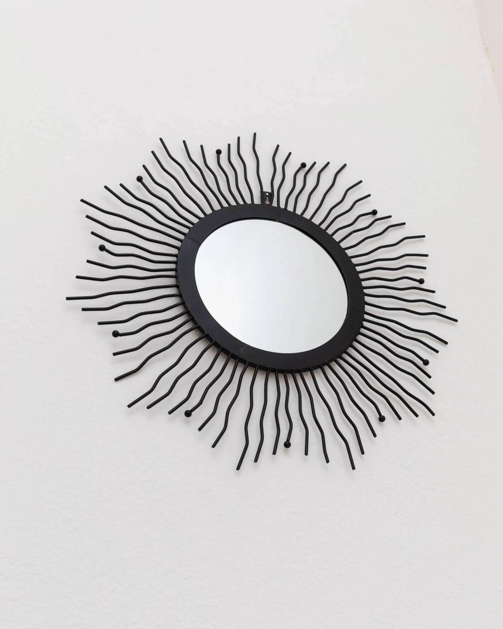 Black metal sunburst wall mirror, round 63x63 cm, vintage 1990s, made in Italy