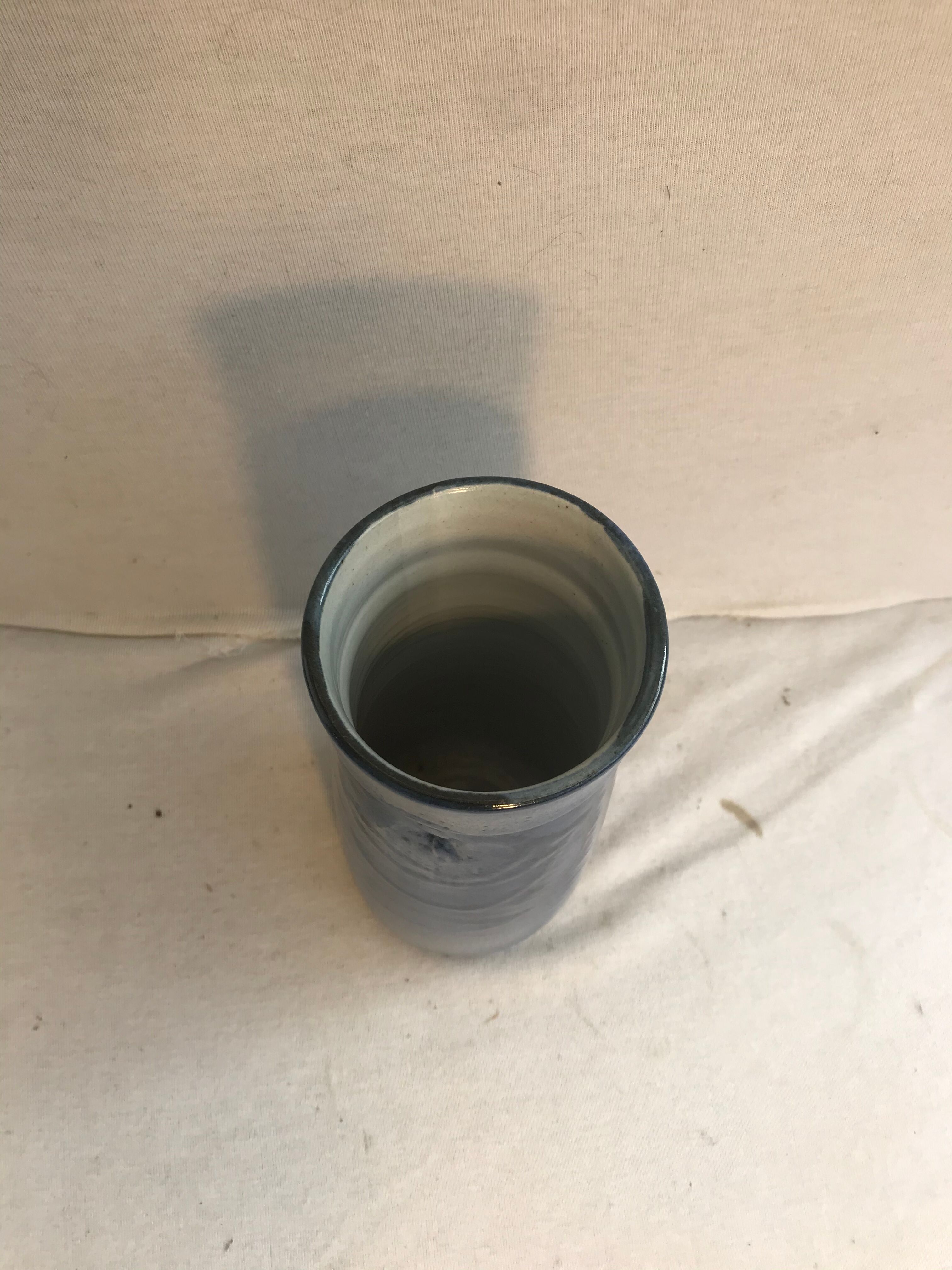 Old roll vase in blue sandstone