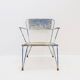 Vintage perforated metal armchair from the 1950s.