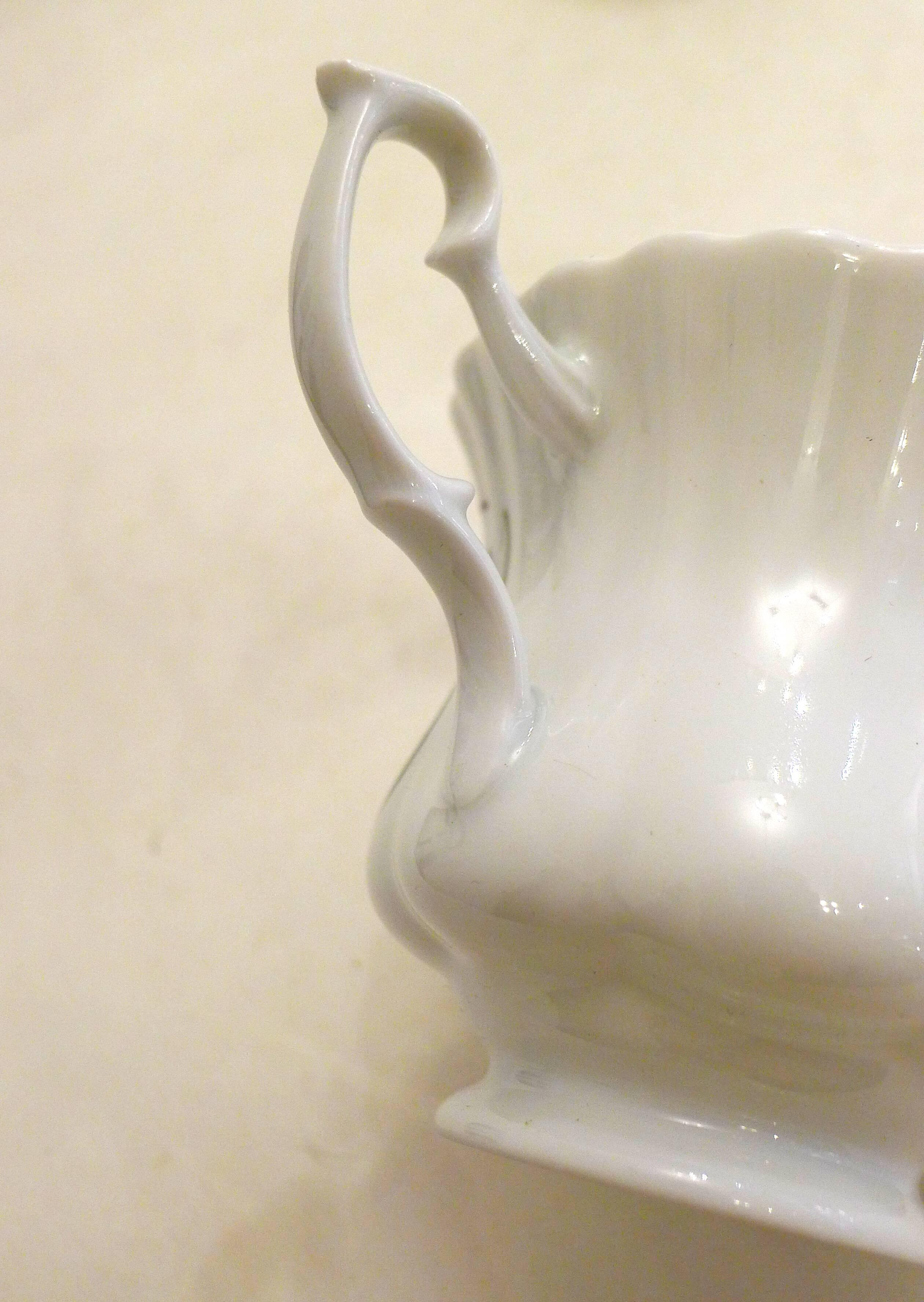 Tea cup, solitary service, naturalistic decoration, in Limoges porcelain.