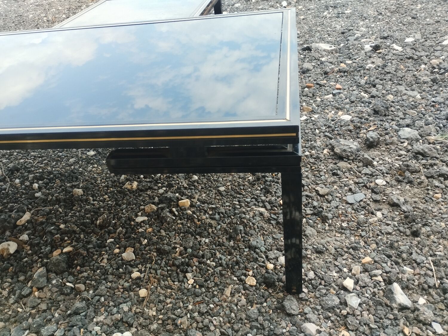 Vintage metal coffee table with glass top.