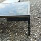 Vintage metal coffee table with glass top.