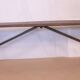 Old bench in Burmese teak with a wrought iron base.