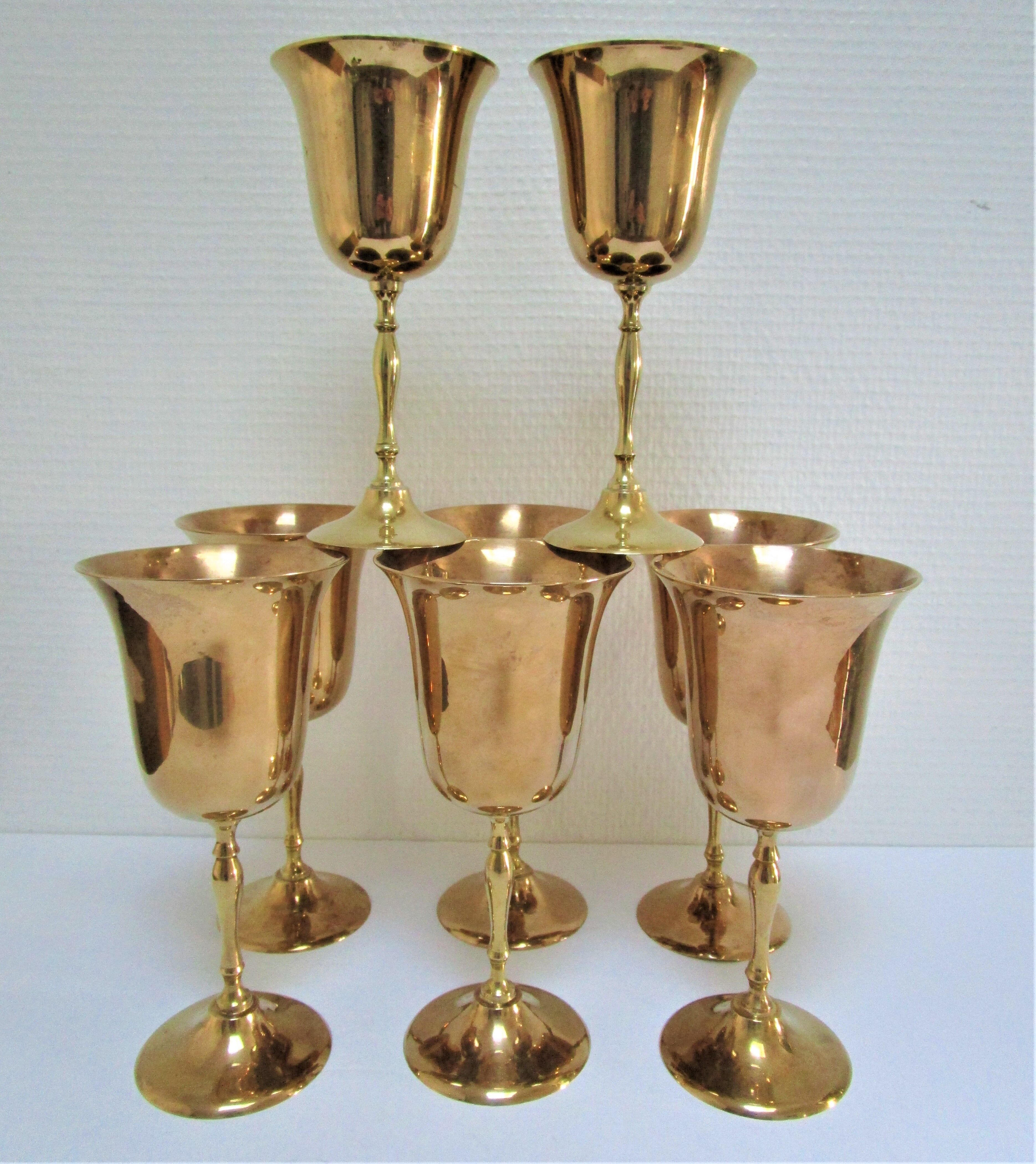 Set of eight vintage solid brass walking glasses