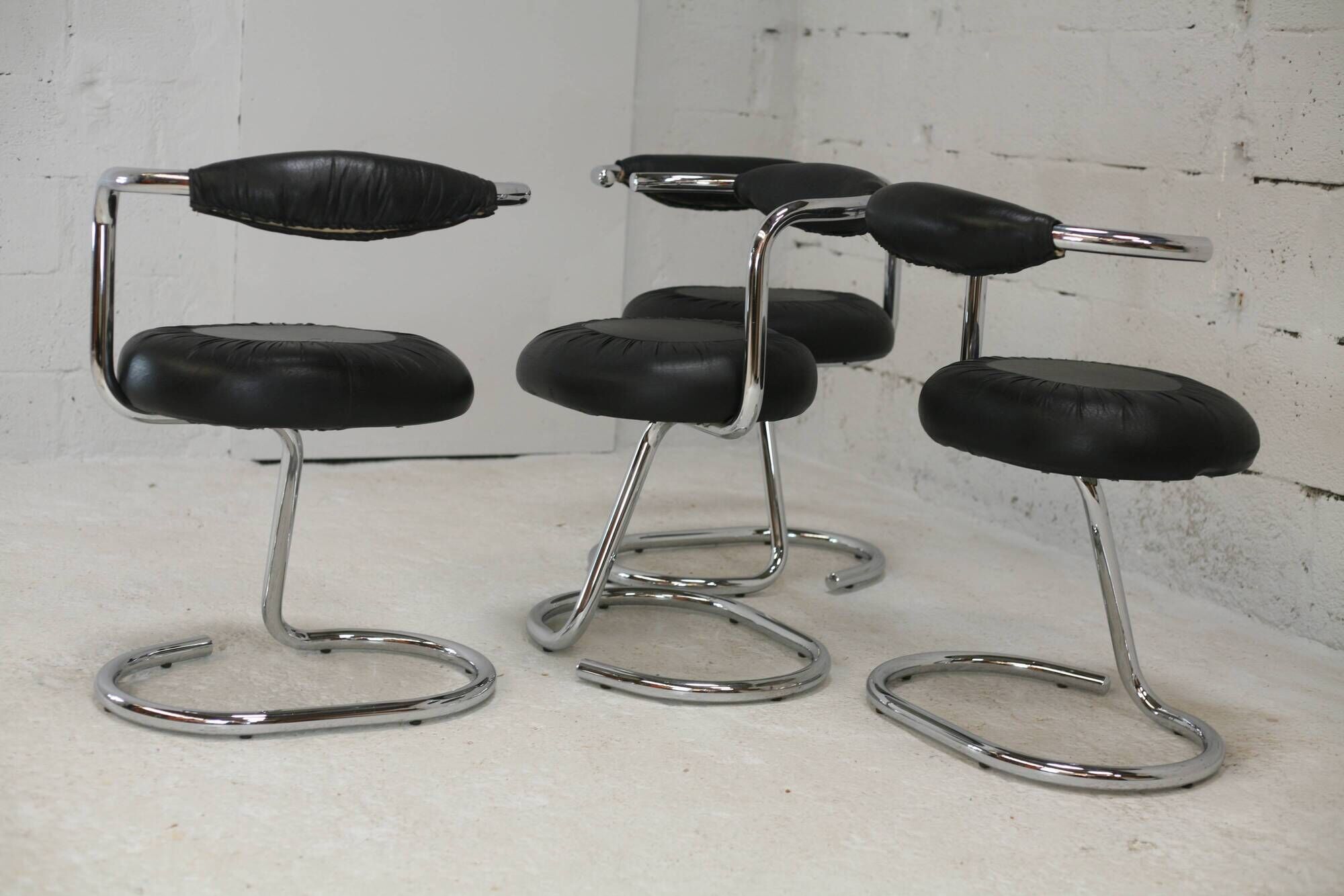 4 chairs tubular steel, imitation black leather, Italy, circa 1970