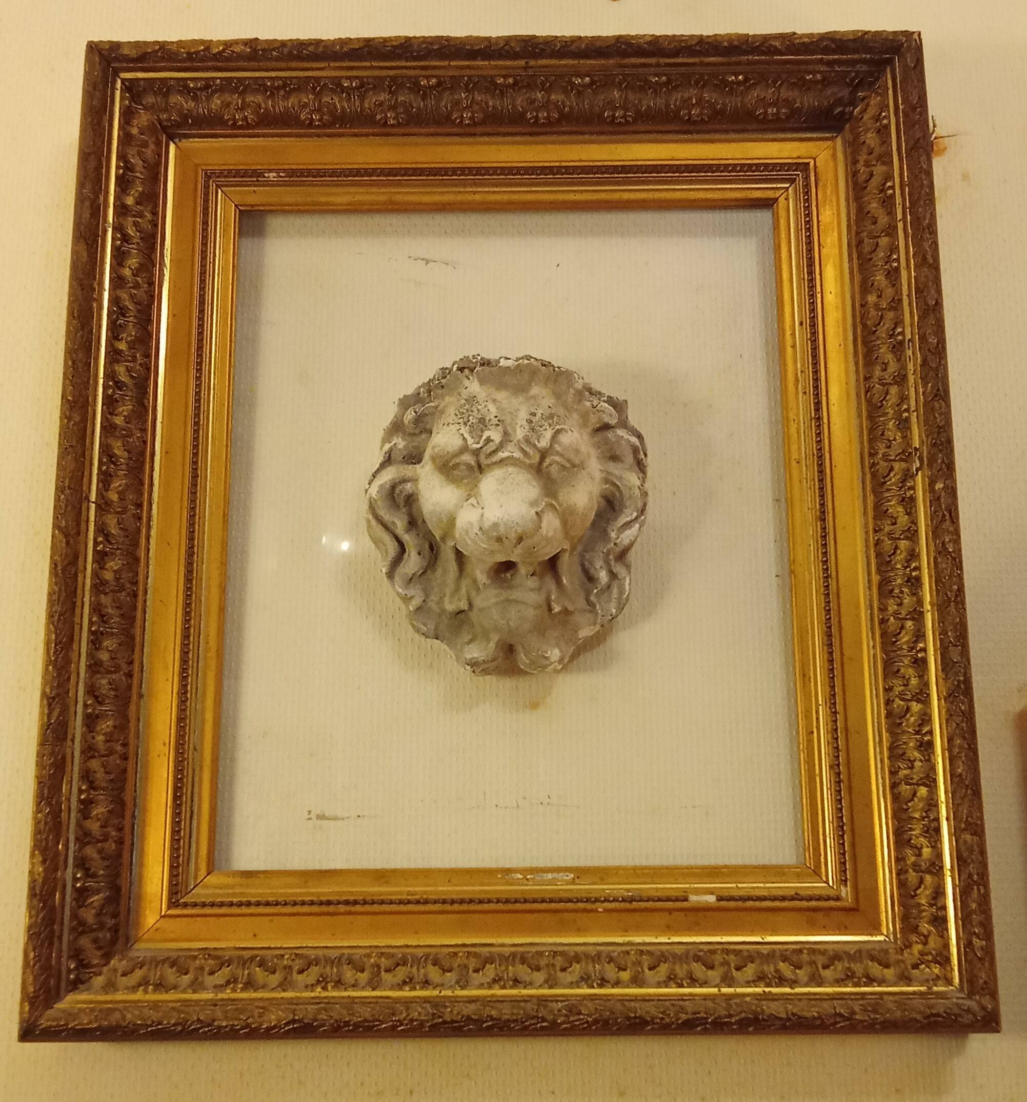 Antique large gilded frame with lion head ornament on plexiglass