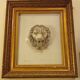 Antique large gilded frame with lion head ornament on plexiglass