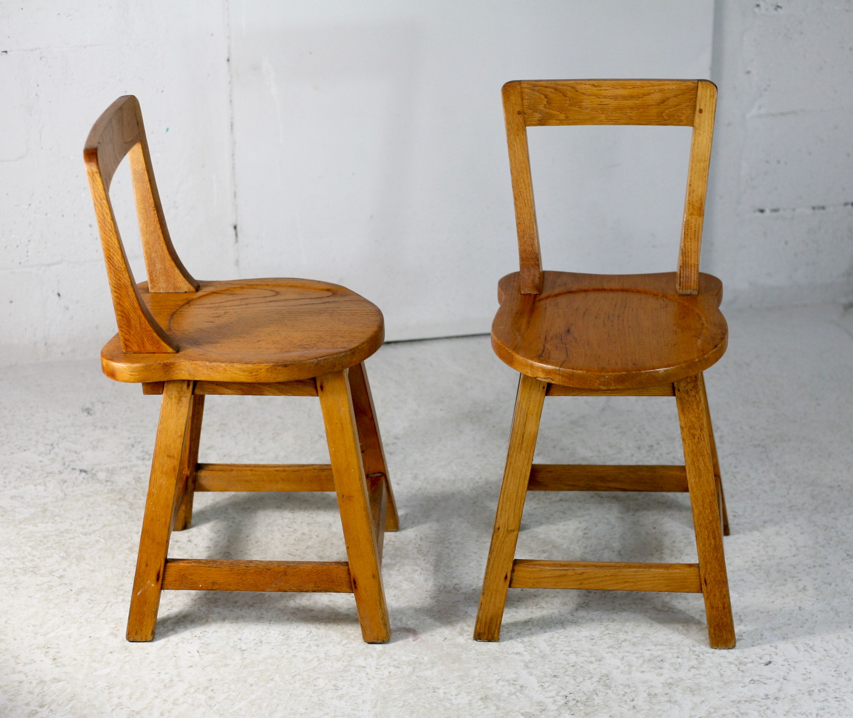 Pair of brutalist wooden back stools. France, circa 1960