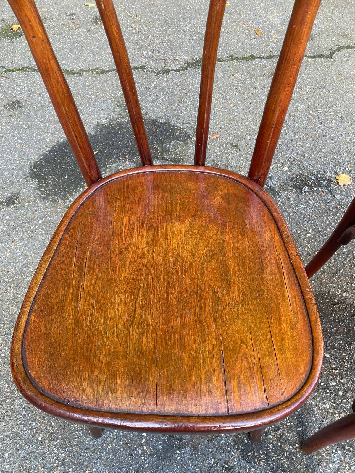 2 curved solid wood bistro chairs in Bordeaux.