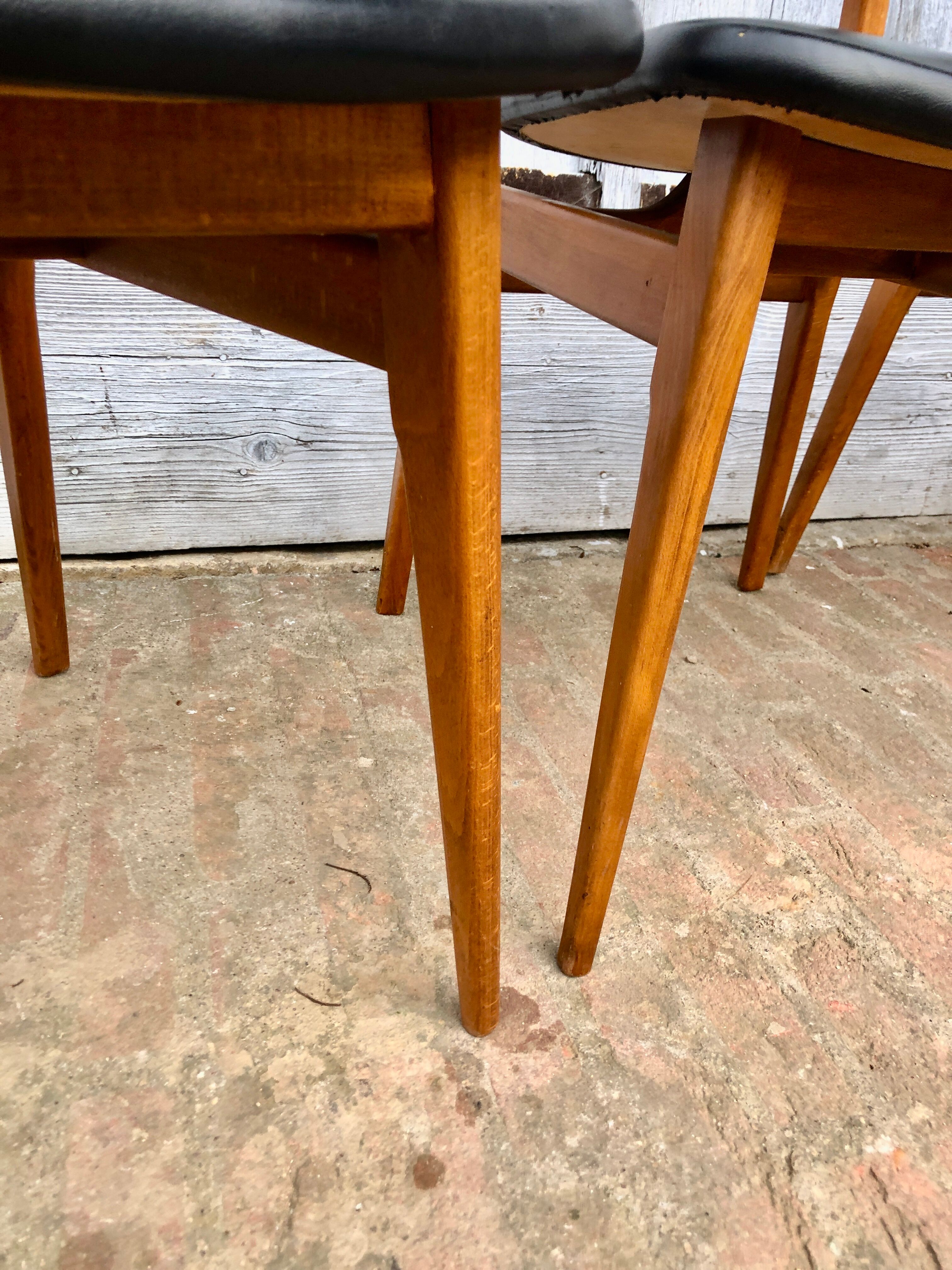 Set of 4 Scandinavian teak and black skai chairs