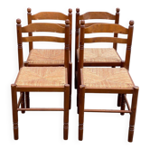 4 dining or kitchen chairs made of solid wood with rush seats.