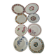 Set of 8 ironstone plates with coordinated designs.