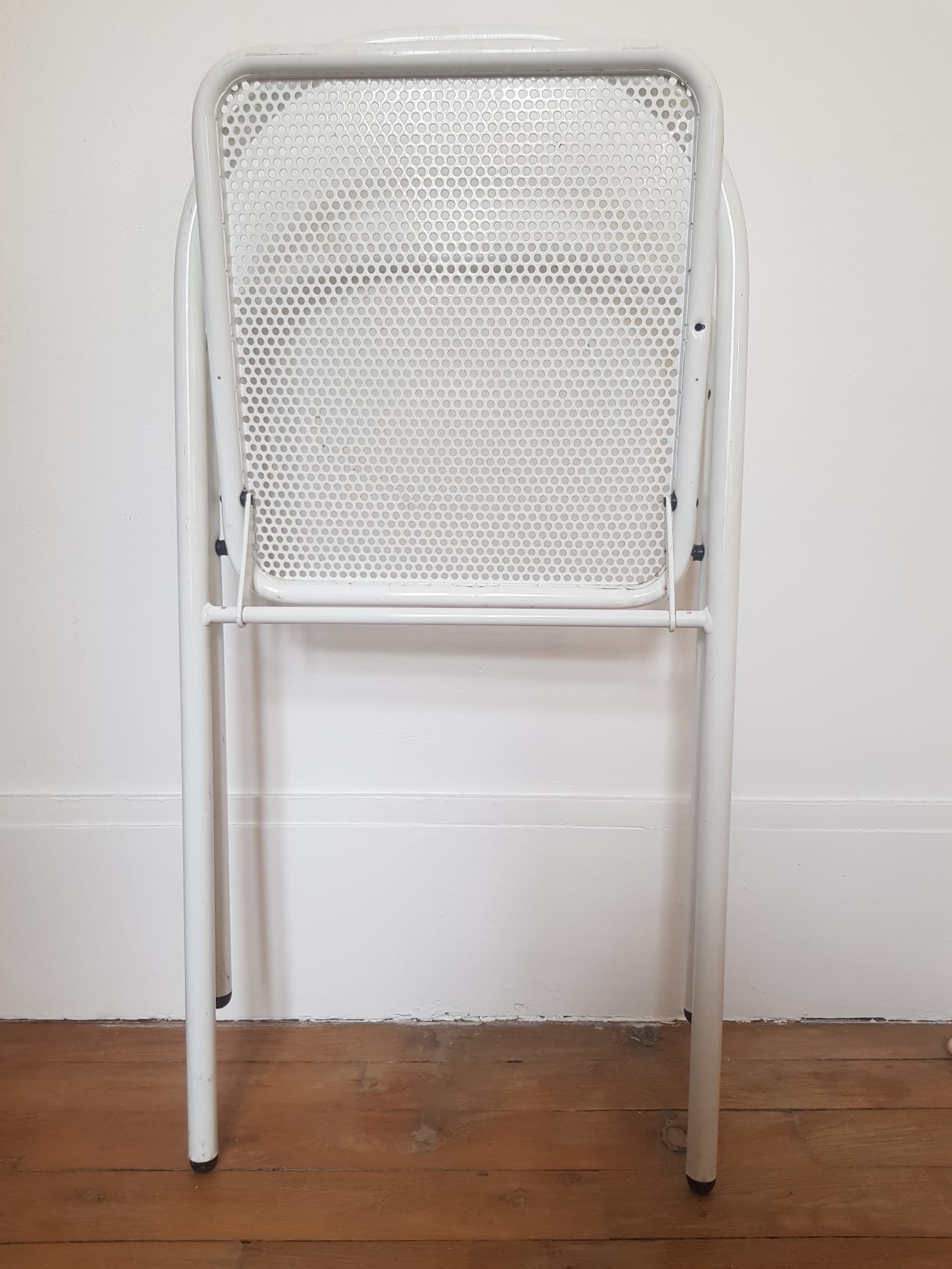 Vintage perforated metal folding chair