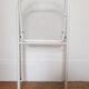 Vintage perforated metal folding chair