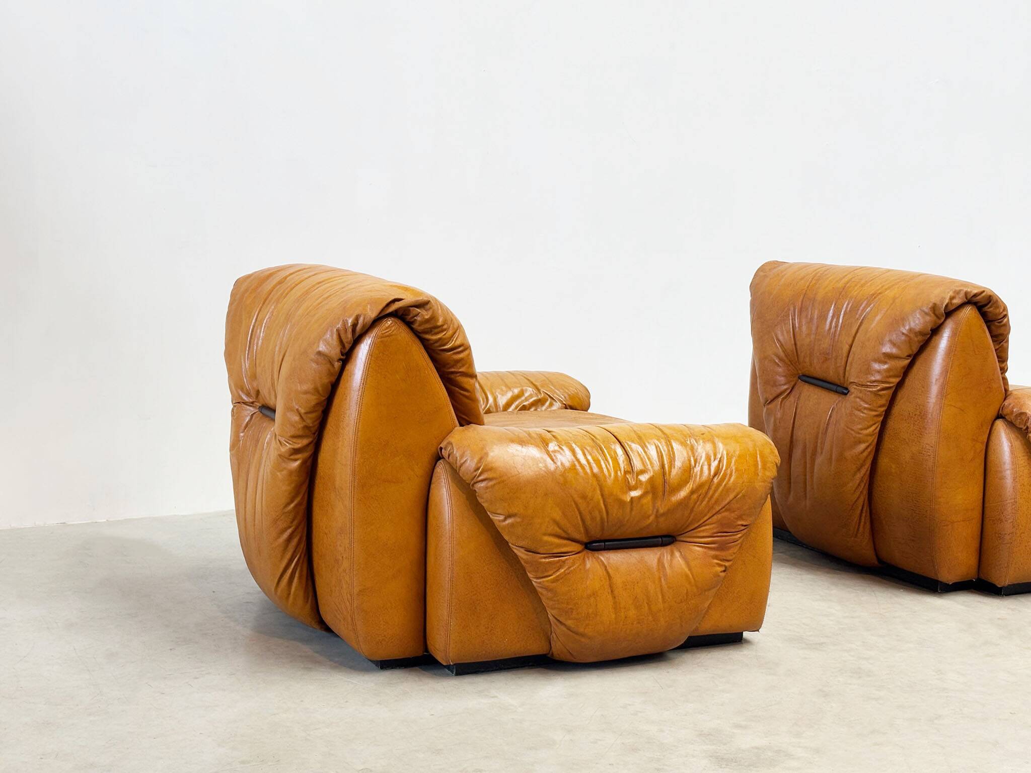 Set of two Italian cognac leather lounge chairs