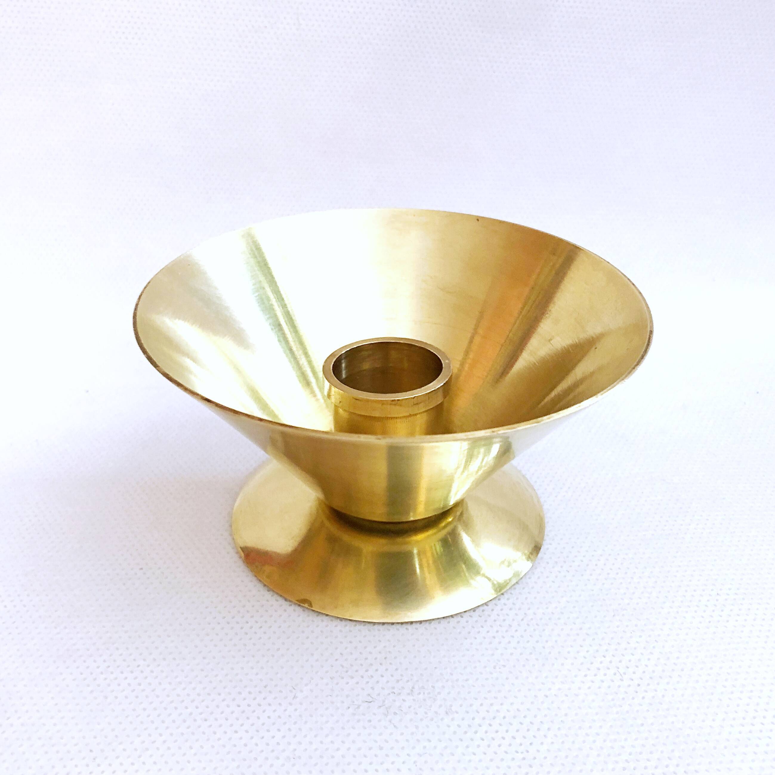 Table candle holder in golden brass