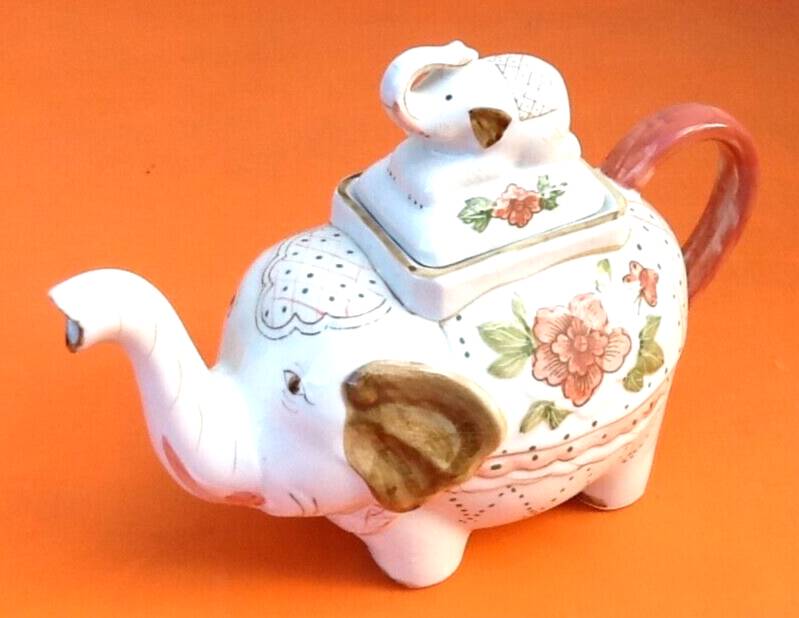 White porcelain teapot decorated with peonies elephant shape