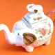 White porcelain teapot decorated with peonies elephant shape