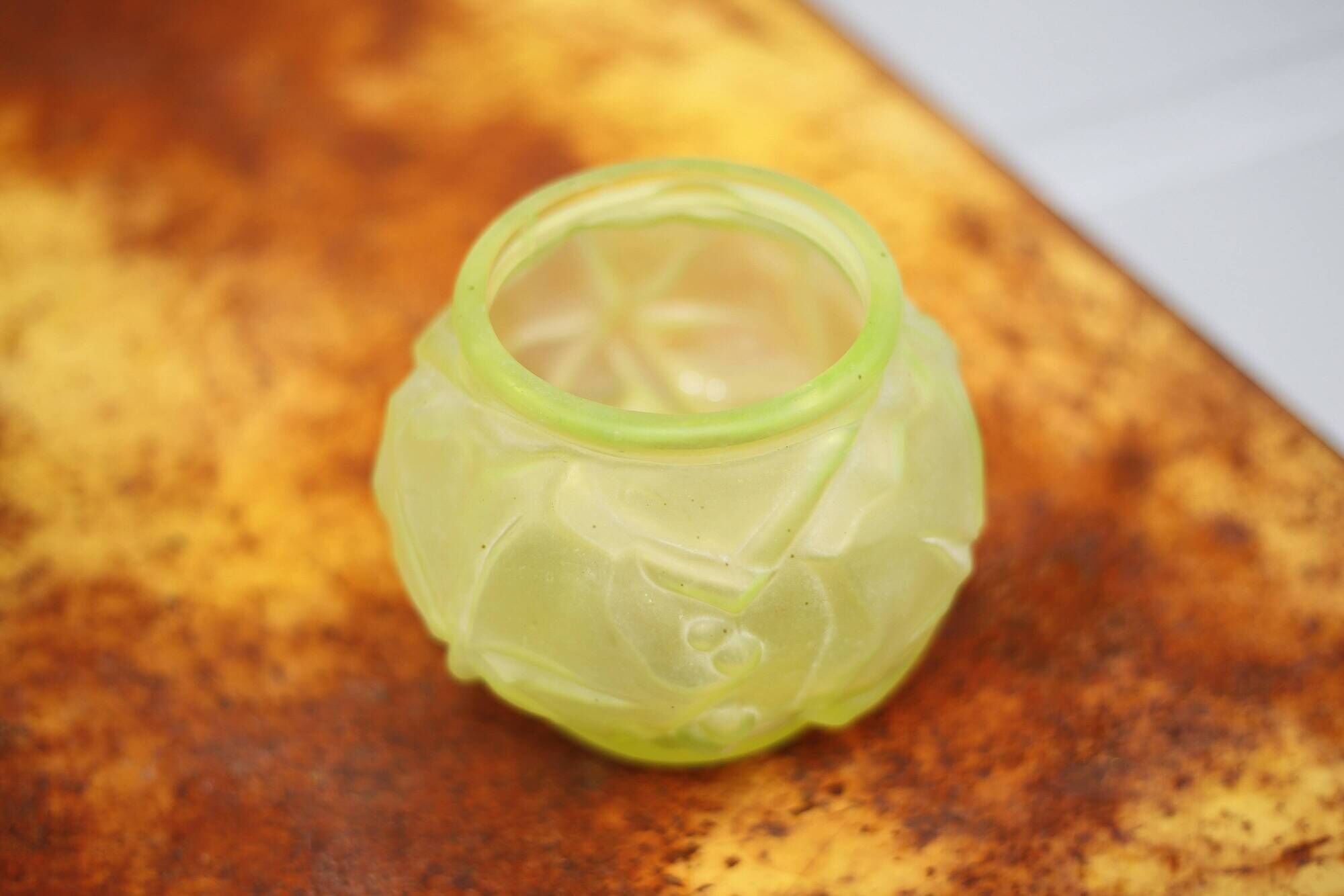 Fluorescent yellow ball vase with vine leaf patterns