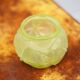 Fluorescent yellow ball vase with vine leaf patterns