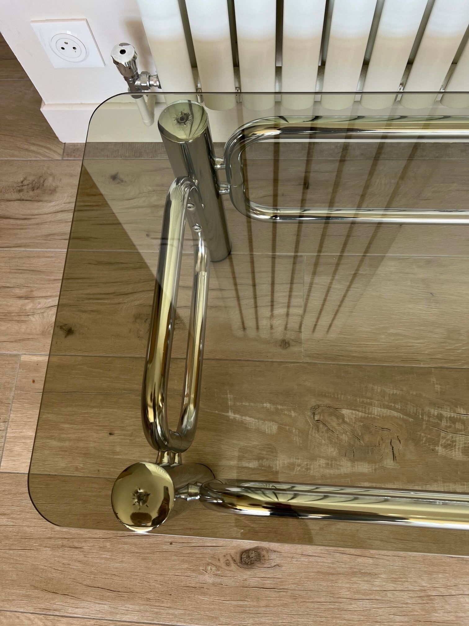 Coffee table in chrome and smoked glass