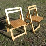 Pair of vintage folding chairs in light wood