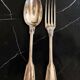 24 silver-plated metal table settings in the filet model.