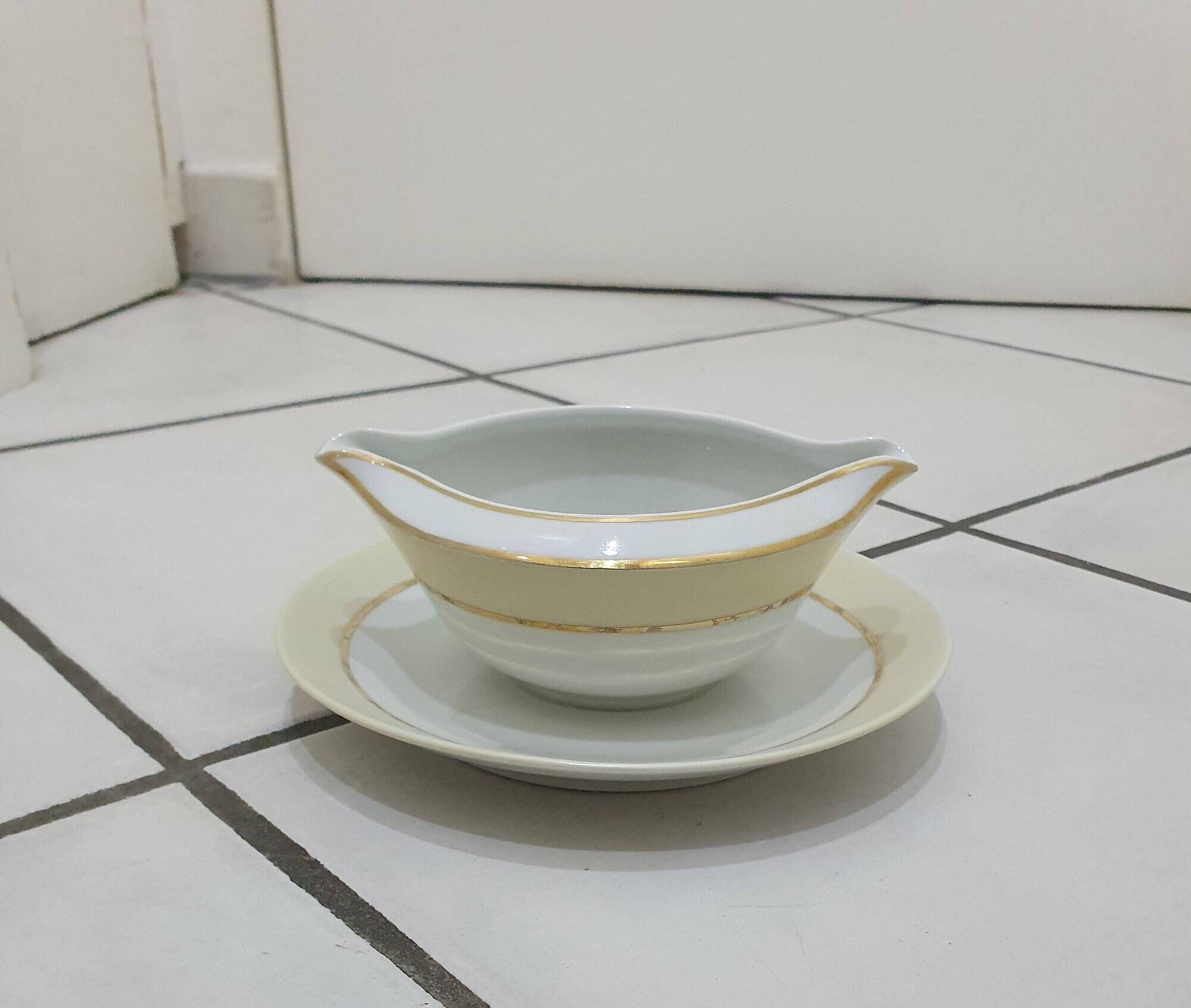 White and yellow porcelain dinner service with gold edging, Poral Limoges France