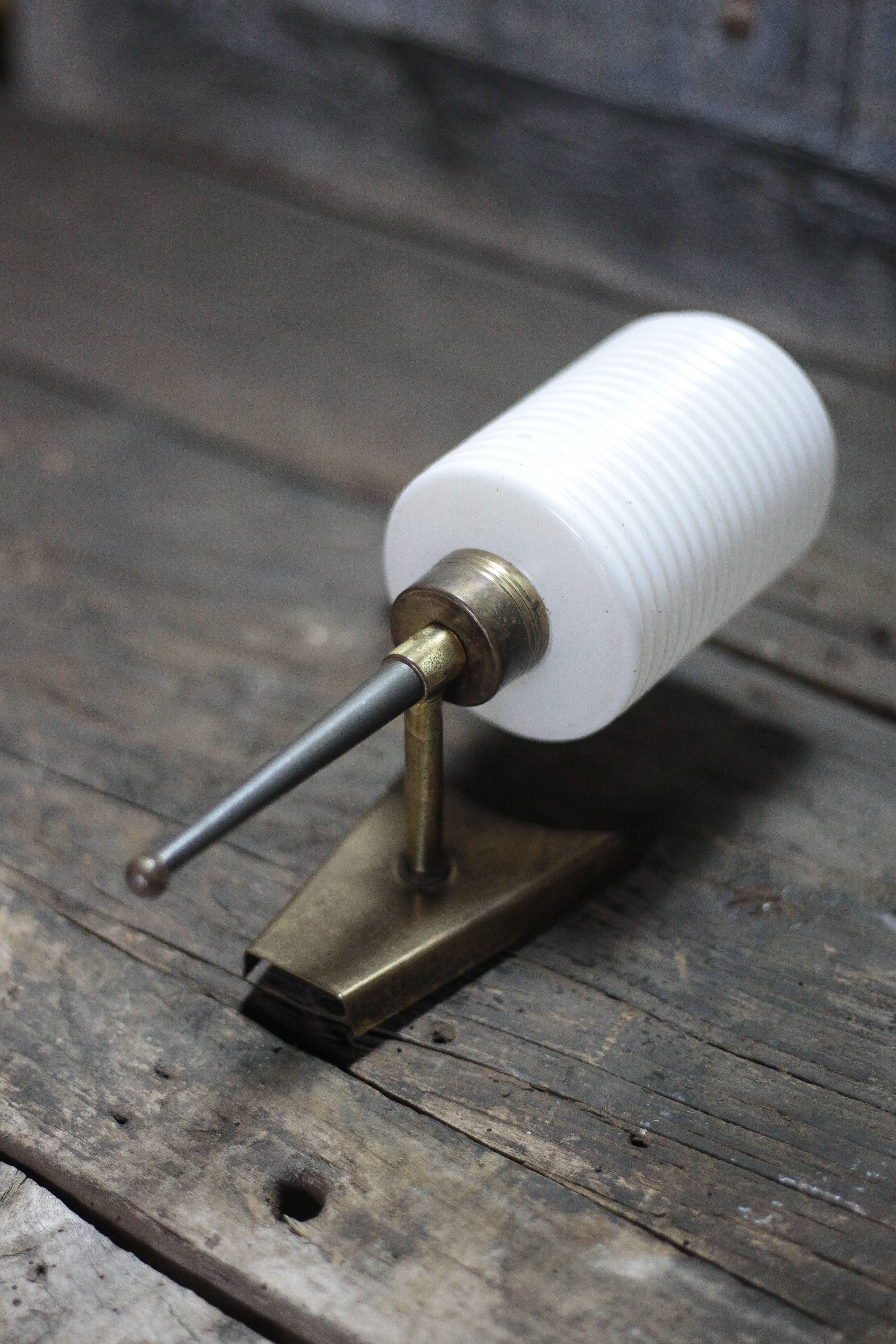 Brass wall light, black lacquered metal and white opal glass, 50s.