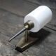 Brass wall light, black lacquered metal and white opal glass, 50s.