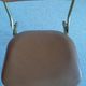 Chaise pliante structure tube et simili cuir