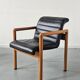 Pair of vintage Flototto armchairs in leather and wood, 1980s.