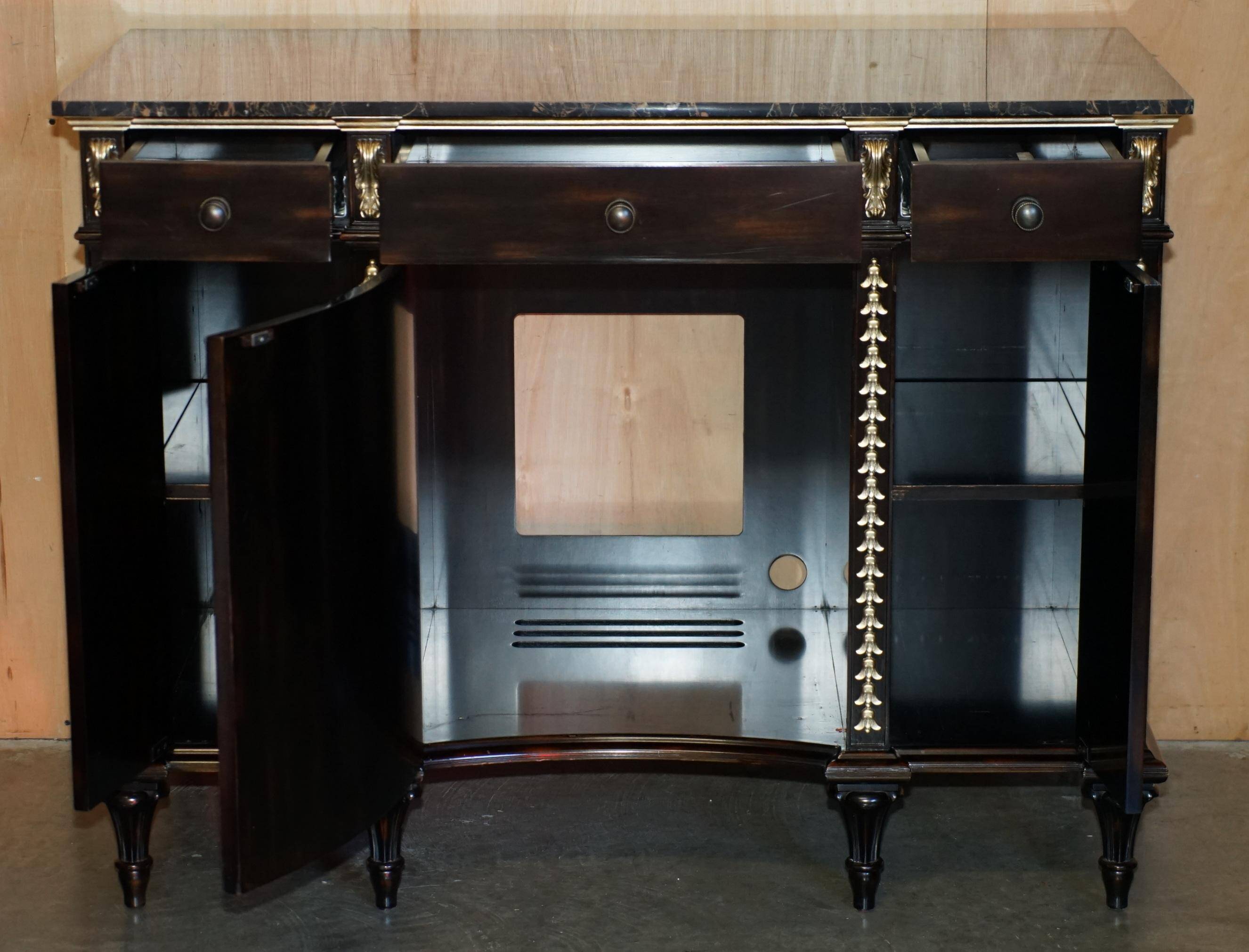 Contemporary Chinese buffet with a marble top and space for a mini-fridge.