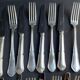 12 Forks and 12 cheese or dessert knives – Orfèvrerie Perrin Paris
